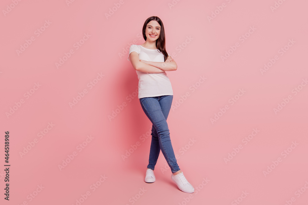 Full size photo of young cheerful girl happy positive smile confident folded hands isolated over pink color background Full size photo of young cheerful girl happy positive smile confident folded hands isolated over pink color background