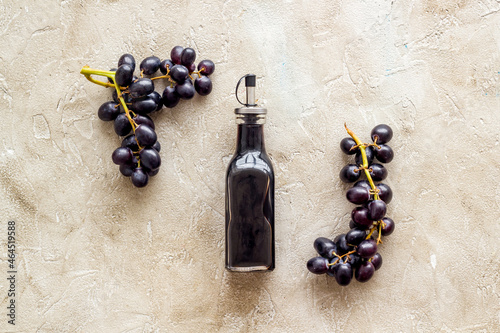 Balsamic vinegar with bunch of fresh grapes photo