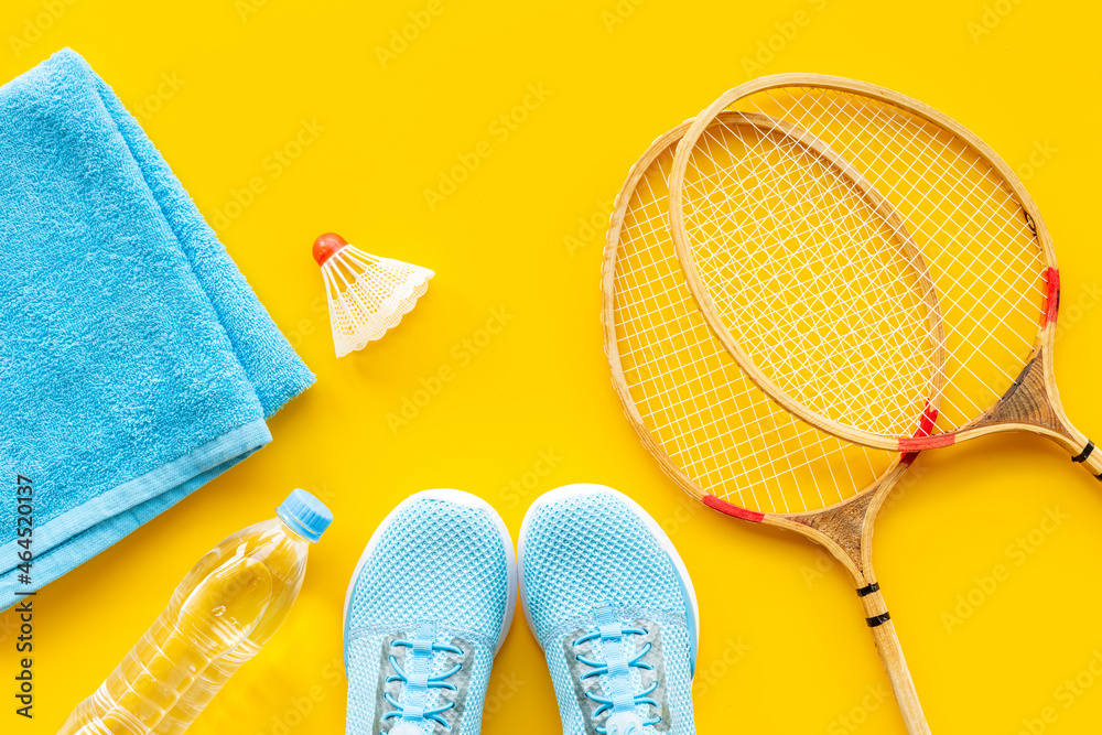 Sports equipment set with badminton rackets and sneakers