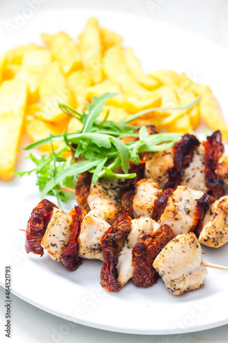 skewers with dry tomatoes and poultry meat