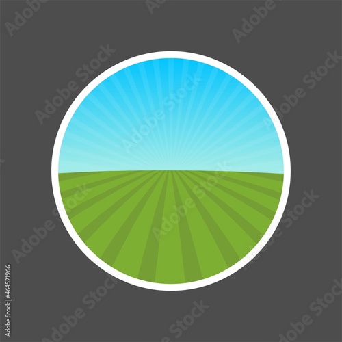 Round shape emblem template with landscape of green agricultural field with radiant blue sky. Vector stock illustration.