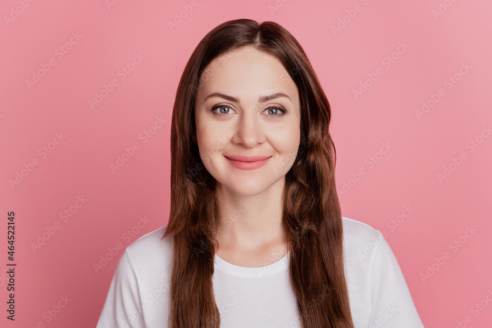 Obraz premium Portrait of positive cheerful adorable lovely girl look camera smile on pink background