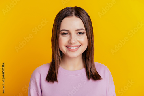 Photo of young cheerful girl good mood toothy smile oral care stomatology isolated over yellow color background