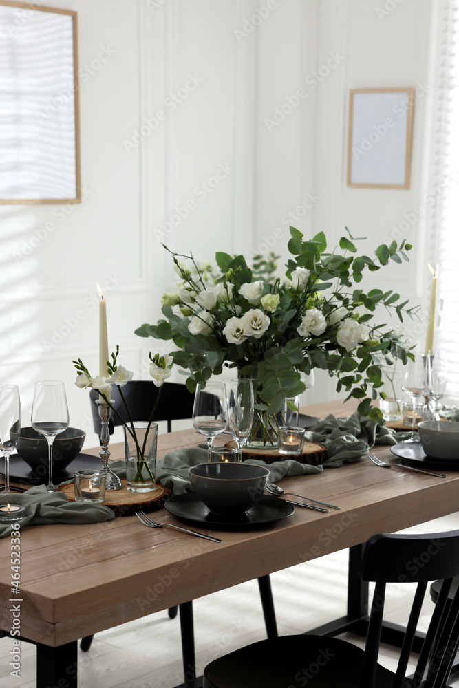 Festive table setting with beautiful tableware and decor indoors