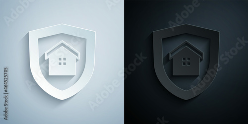 Paper cut House with shield icon isolated on grey and black background. Insurance concept. Security, safety, protection, protect concept. Paper art style. Vector