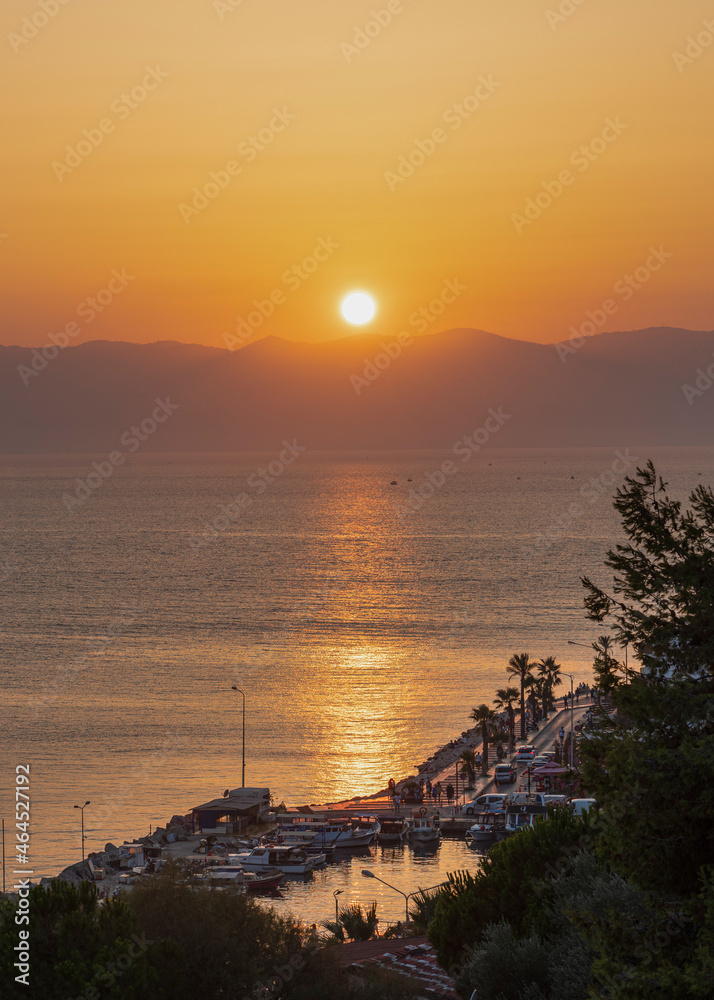 Cesme, Izmir, Turkey - August 25 2021: Sunset on Aegean Sea in Cesme City Cesme, Izmir, Turkey - August 25 2021: Sunset on Aegean Sea in Cesme City