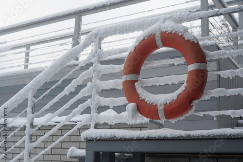 a lifebuoy is hanging in the snow