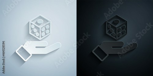 Paper cut Game dice icon isolated on grey and black background. Casino gambling. Paper art style. Vector