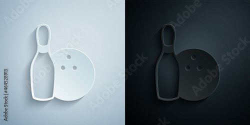 Paper cut Bowling pin and ball icon isolated on grey and black background. Sport equipment. Paper art style. Vector