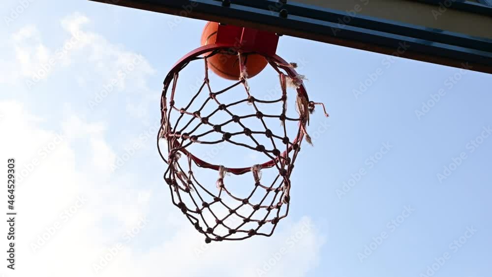 Shooting orange basketball ball into the basket Shooting orange basketball ball into the basket