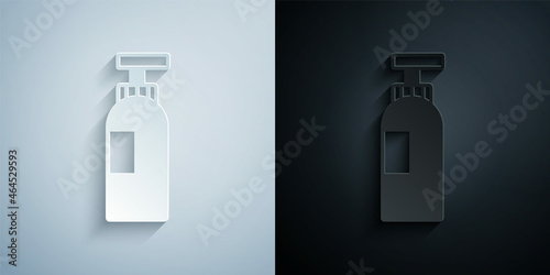 Paper cut Bottle of shampoo icon isolated on grey and black background. Paper art style. Vector