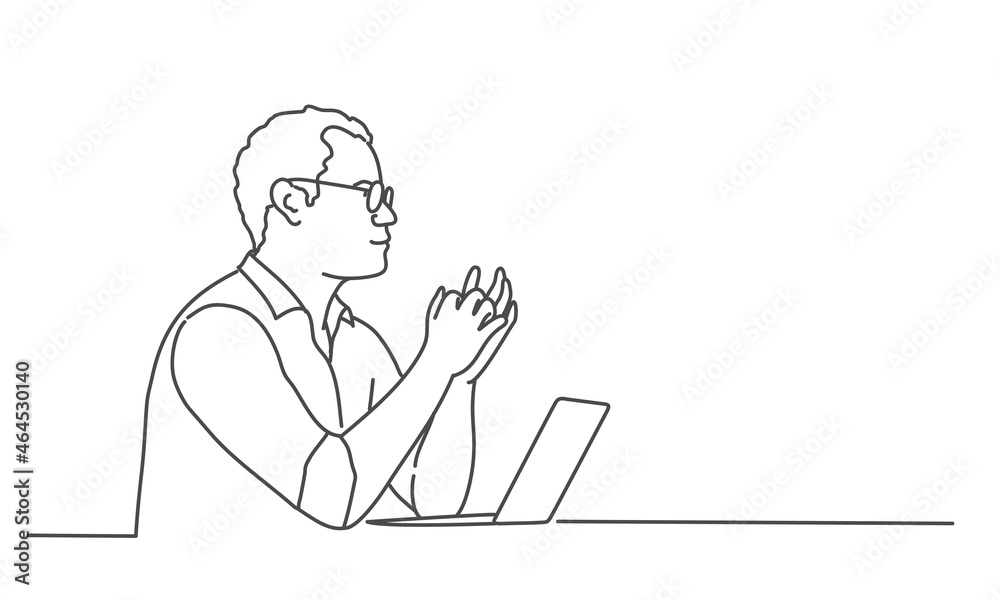 Young businessman in glasses sits with a laptop at the table. Young businessman in glasses sits with a laptop at the table.