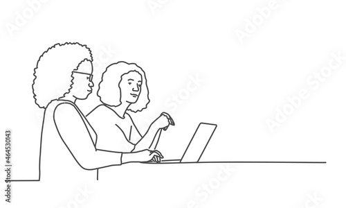 Women work while sitting in their office.