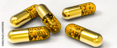 Photos 3d golden capsules render. Stock image.