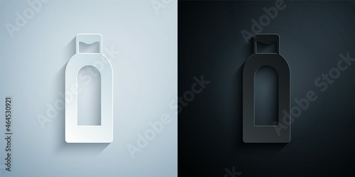 Paper cut Bottle of shampoo icon isolated on grey and black background. Paper art style. Vector