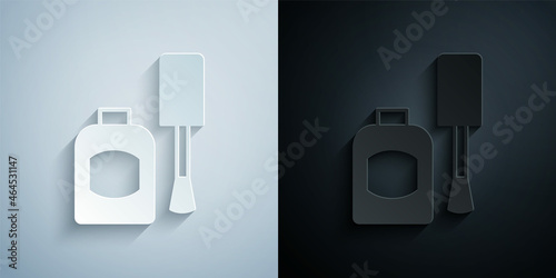 Paper cut Bottle of nail polish icon isolated on grey and black background. Paper art style. Vector