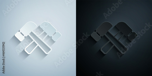 Paper cut Crossed hammer icon isolated on grey and black background. Tool for repair. Paper art style. Vector