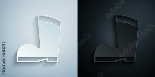 Paper cut Waterproof rubber boot icon isolated on grey and black background. Gumboots for rainy weather, fishing, gardening. Paper art style. Vector