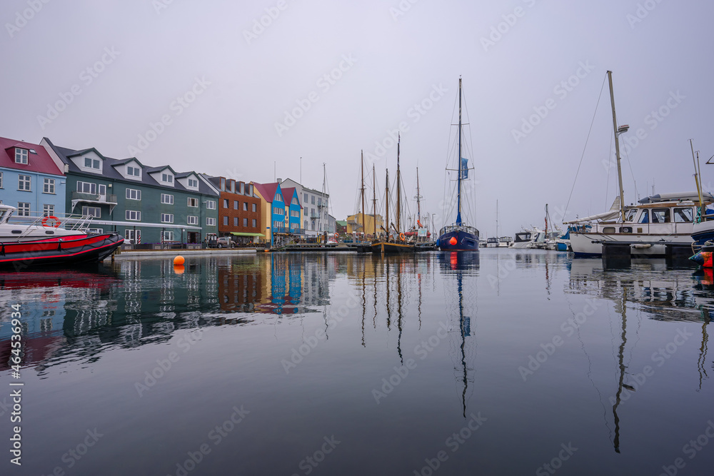 Fototapeta premium View of the beautiful city of Torshavan and its marina with sailing boats in the Faroe Islands 