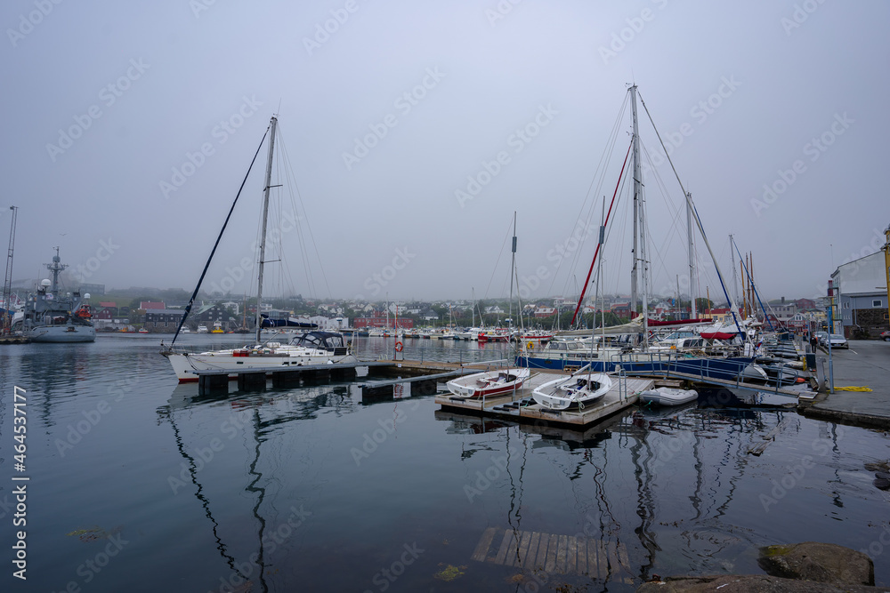 View of the beautiful city of Torshavan and its marina with sailing boats in the Faroe Islands 