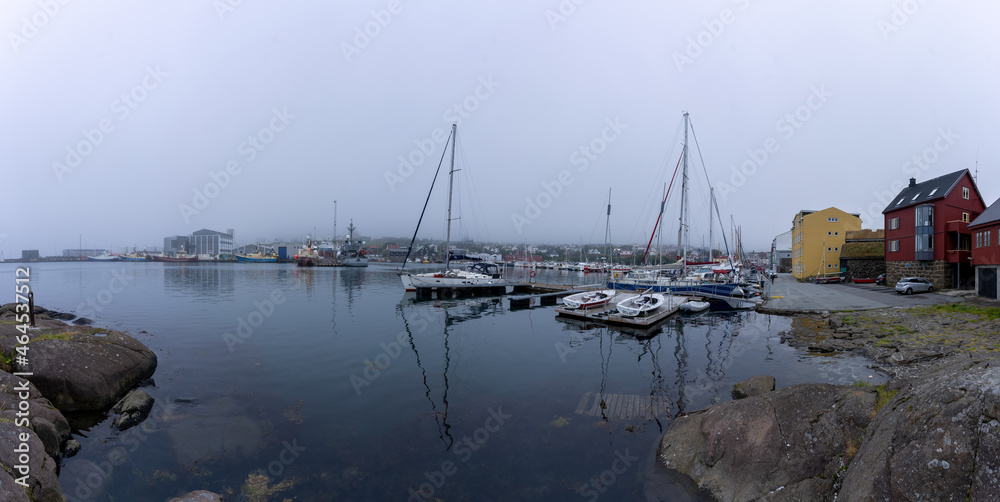 View of the beautiful city of Torshavan and its marina with sailing boats in the Faroe Islands 