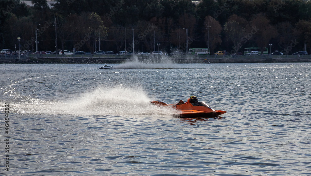 Fototapeta premium sport. motor boat races. speed, water sports. competition on the water on a sunny day
