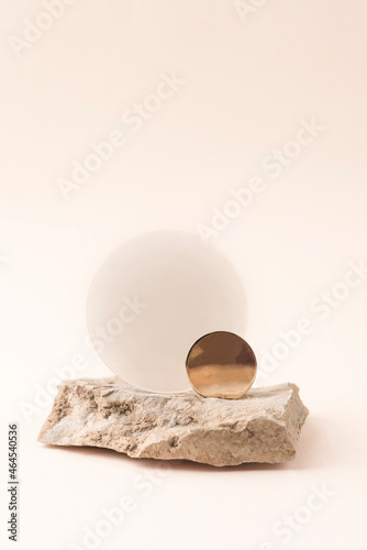 Fototapeta Naklejka Na Ścianę i Meble -  Natural balancing composition  with natural asymmetrical stone and geometric elements for graphic design. Equilibrium, zero waste, Earth tones, beige background