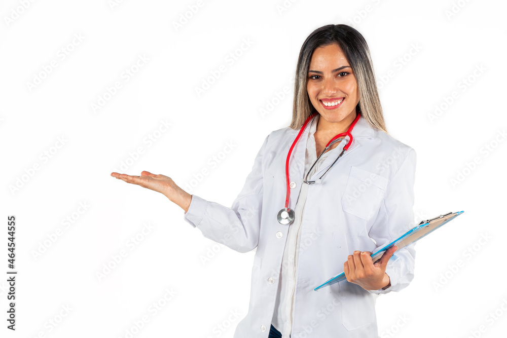 A young medical woman looking straight ahead with her right hand extended pretending to hold something and a medical record in the other hand. Concept of professional woman, personal health, good news A young medical woman looking straight ahead with her right hand extended pretending to hold something and a medical record in the other hand. Concept of professional woman, personal health, good news