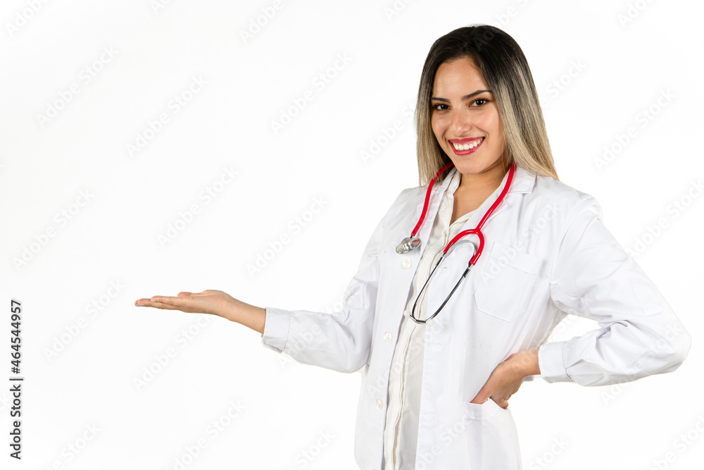 An Attractive Young Doctor with her extended right hand control pretending to hold an object while smiling. His left hand on her waist. Concept of professional woman, health personnel. copy space An Attractive Young Doctor with her extended right hand control pretending to hold an object while smiling. His left hand on her waist. Concept of professional woman, health personnel. copy space
