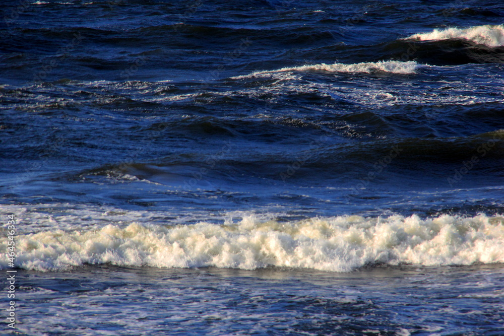 Seascape during a storm with big waves, close-up, Carnikava, Latvia. Big and powerful sea waves during the storm Seascape during a storm with big waves, close-up, Carnikava, Latvia. Big and powerful sea waves during the storm