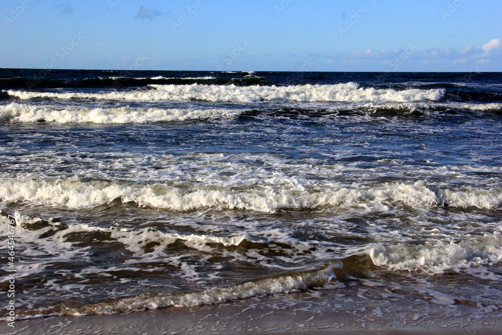 Fototapeta premium Seascape during a storm with big waves, close-up, Carnikava, Latvia. Big and powerful sea waves during the storm 