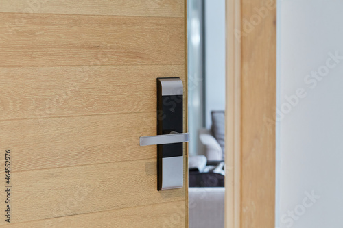 Digital door lock security systems for access protection of hotel, apartment door. Electronic door handle with key pads numbers. Selective focus