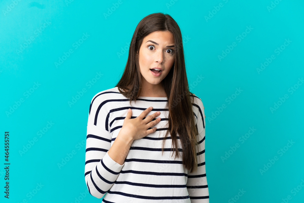 Teenager Brazilian girl over isolated blue background pointing to oneself Teenager Brazilian girl over isolated blue background pointing to oneself