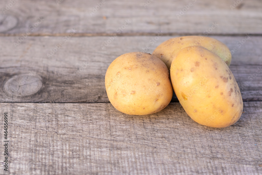potatoes on a wooden background, concept agriculture.Copy Space potatoes on a wooden background, concept agriculture.Copy Space