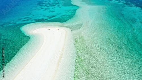 Happy woman walking on a perfect beach