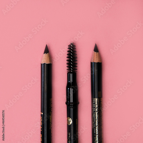 Makeup product, Lip liner with mascara on a delighted pink background
