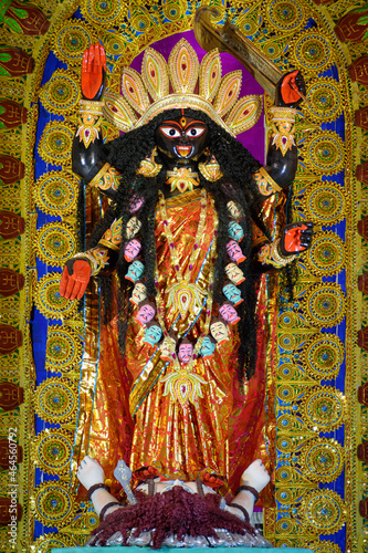 Idol of Goddess Maa Kali at a decorated puja pandal in Kolkata, West Bengal, India. Kali puja also known as Shyama Puja is a famous religious festival of Hinduism.