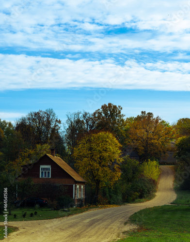 A rocky road up the hill. The house at the side of the road.