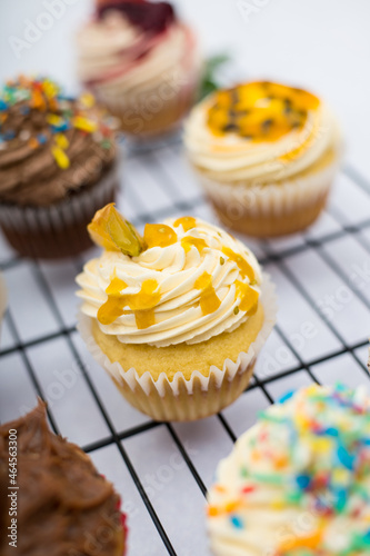 Lulo cupcake with white cream on a marble backgroundon a grid