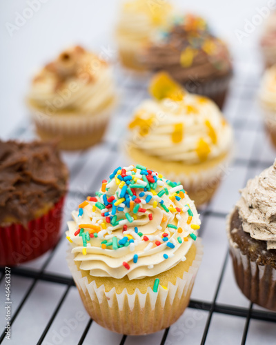 cupcake with sprinkles on a marble background on a grid