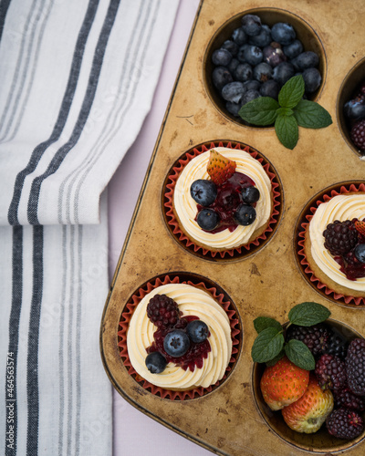 cupcake with berries on a mold with a cloth