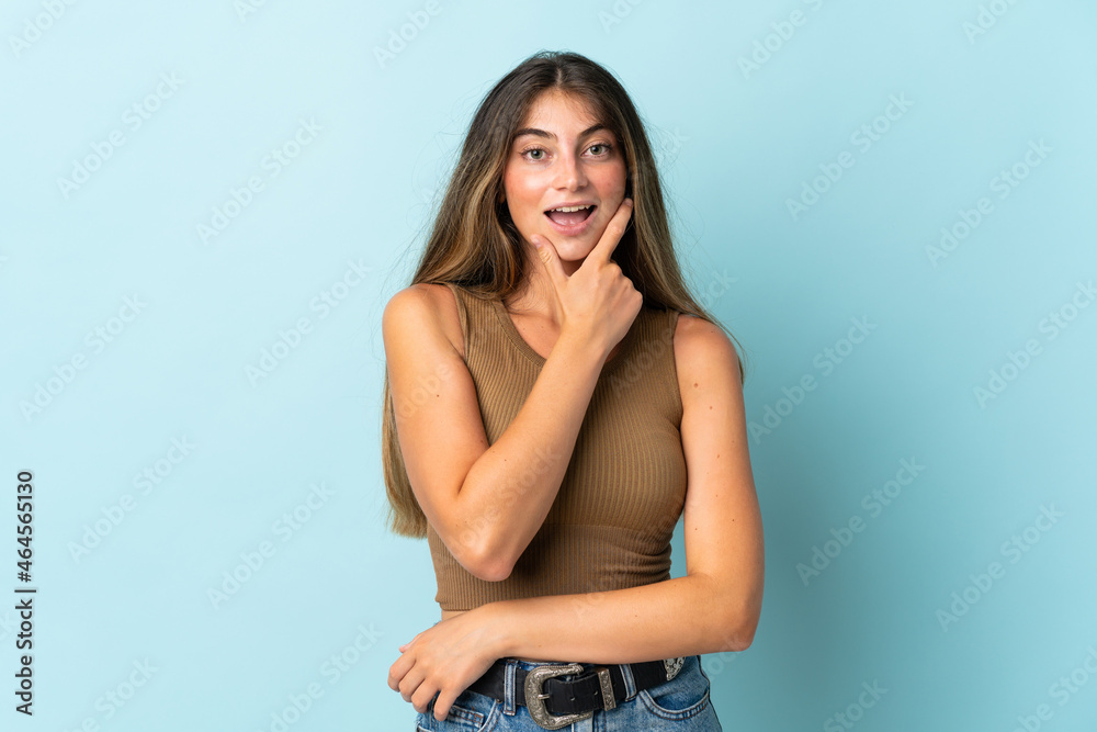 Young caucasian woman isolated on blue background happy and smiling Young caucasian woman isolated on blue background happy and smiling