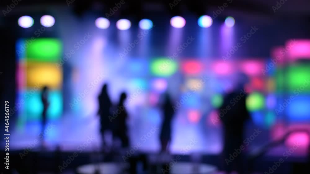 Unfocused club in hotel. lighting lights in a dark concert hall. people silhouettes. Very low light, high gain. Unfocused club in hotel. lighting lights in a dark concert hall. people silhouettes. Very low light, high gain.