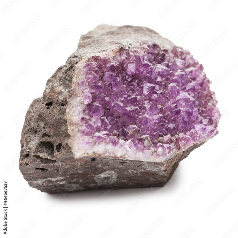 Crystals of lilac amethyst on a fracture of brown stone. Semiprecious stone