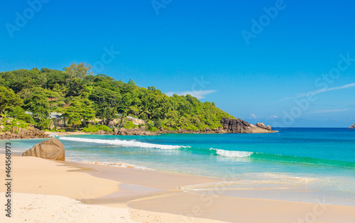 Beautiful nature of the sea tropical landscape. Exotic tropical nature of the Seychelles, a white beach surrounded by palm trees and granite rocks.