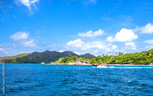 Beautiful nature of the sea tropical landscape. Exotic tropical nature of the Seychelles, a white beach surrounded by palm trees and granite rocks.