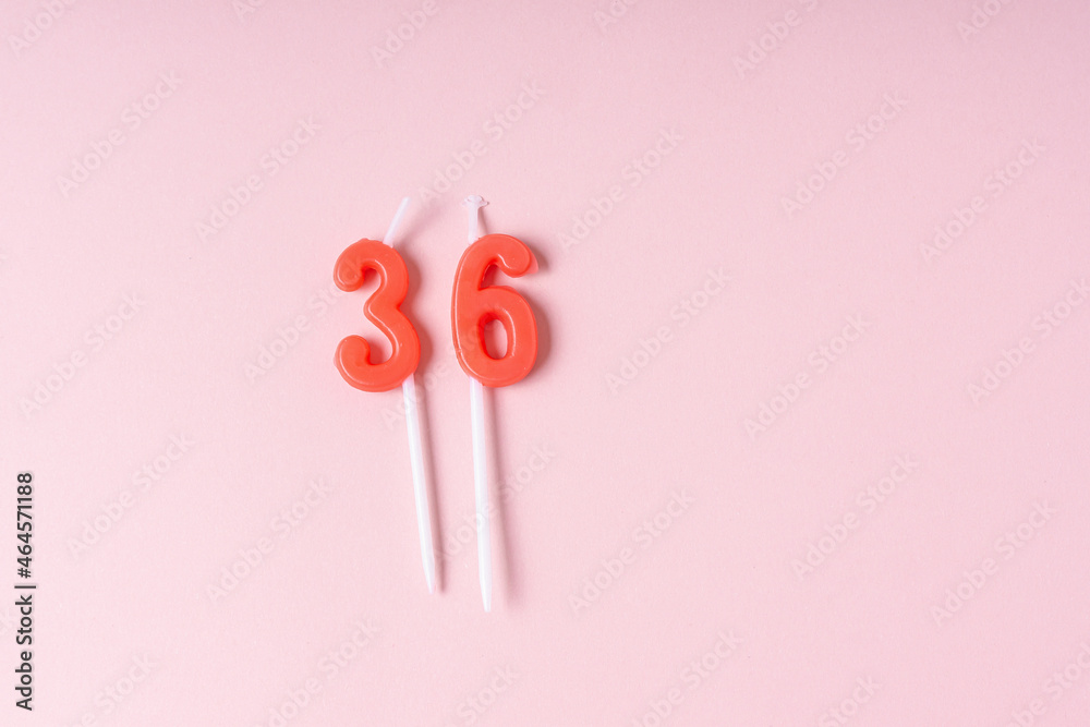 Festive number red 36 candles. Pink background. Space for text