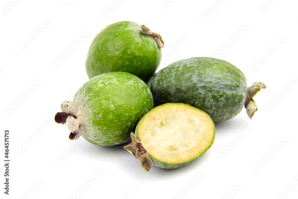 Feijoa fruit or whole and half pineapple guava isolated on white Feijoa fruit or whole and half pineapple guava isolated on white