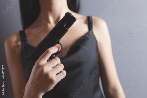 young woman holding a pistol
