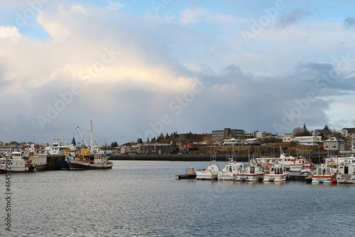 Many small fishing boats are in the port at the pier © Uladzimir